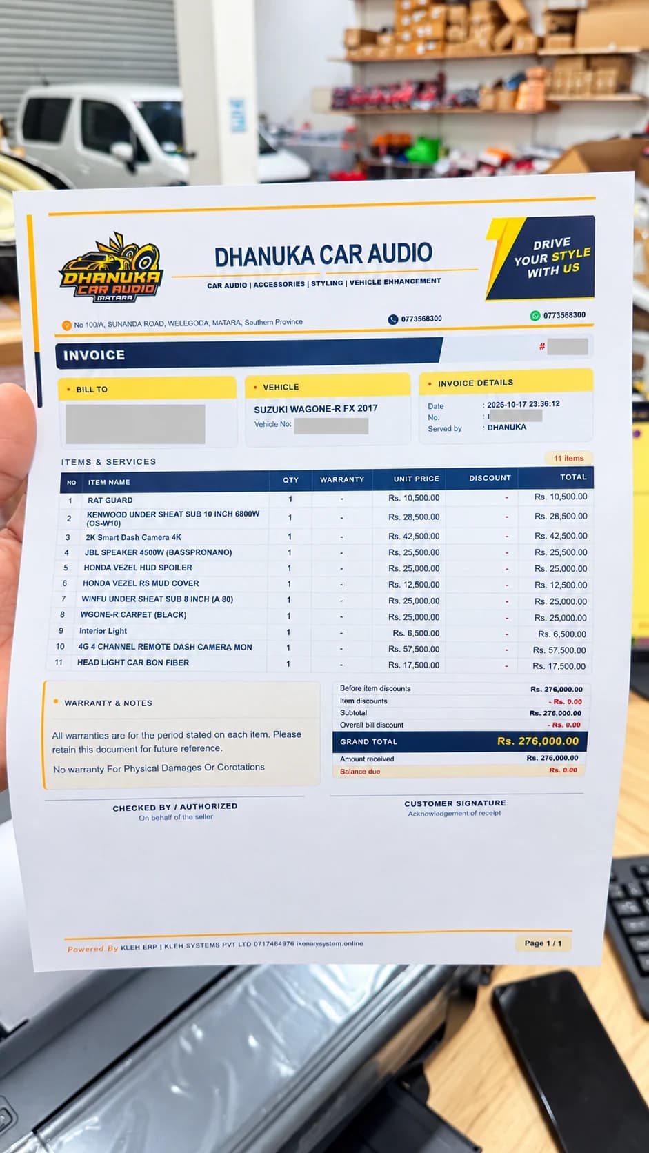 AI-enhanced navy and yellow Dhanuka Car Audio invoice layout