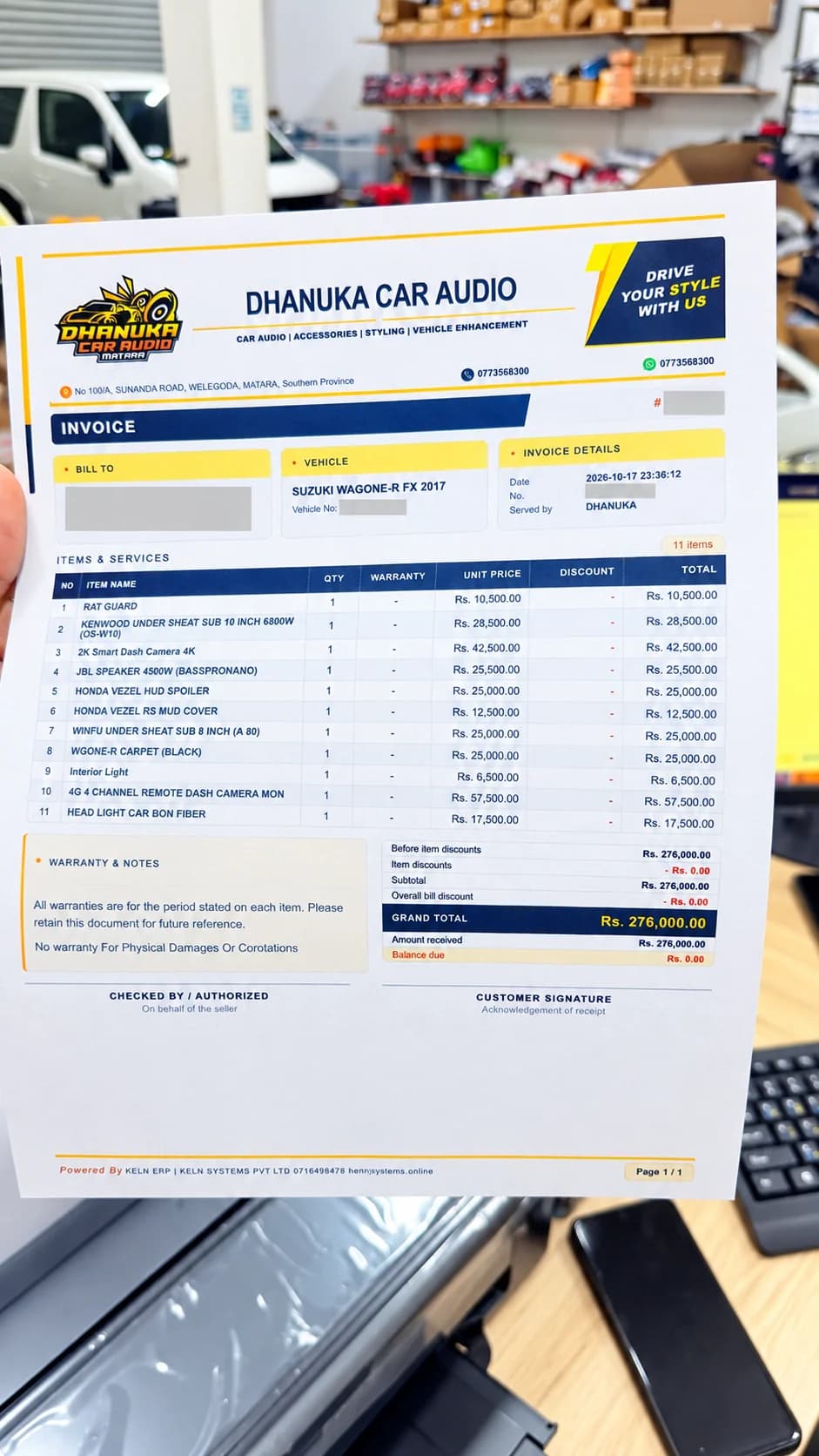 AI-enhanced custom car audio invoice presented inside the Matara workshop