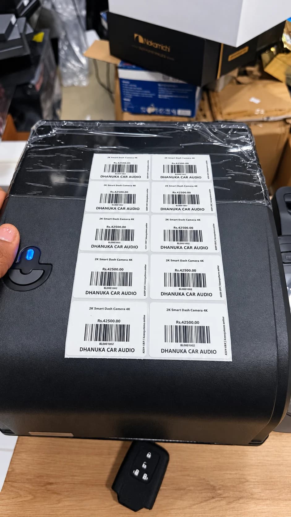 AI-enhanced Dhanuka Car Audio product barcode labels on the label printer