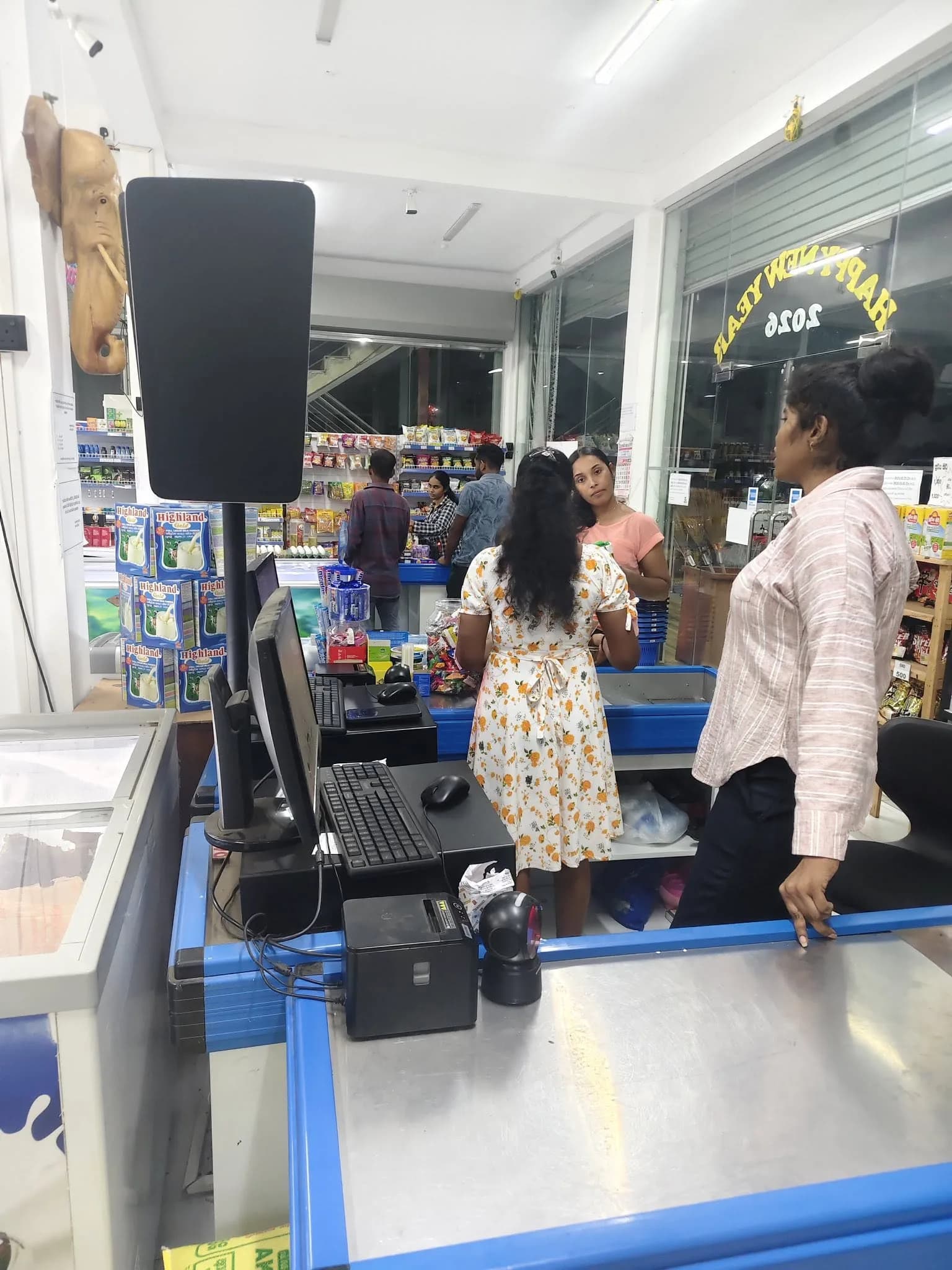Sahan Traders staff coordinating checkout operations at the point of sale