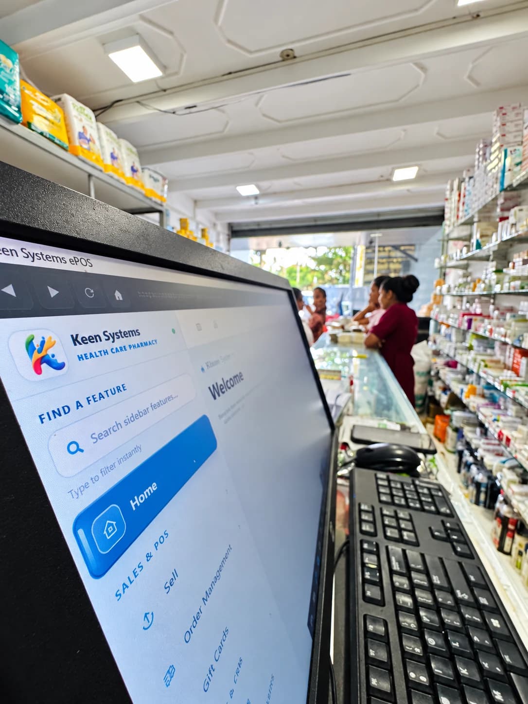 Keen Systems ERP workstation beside the pharmacy service counter