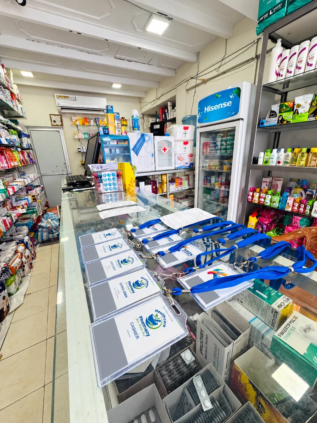 Pharmacy counter with branch staff cards and receipt samples