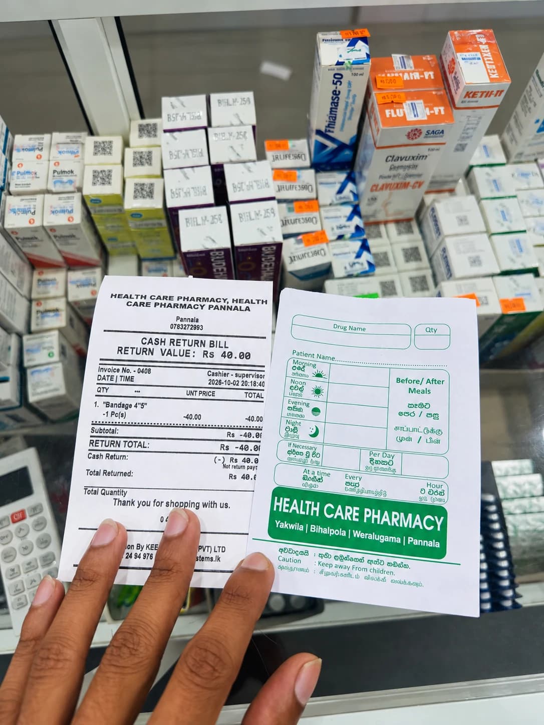 Health Care Pharmacy receipt and medicine bag showing the four branch names